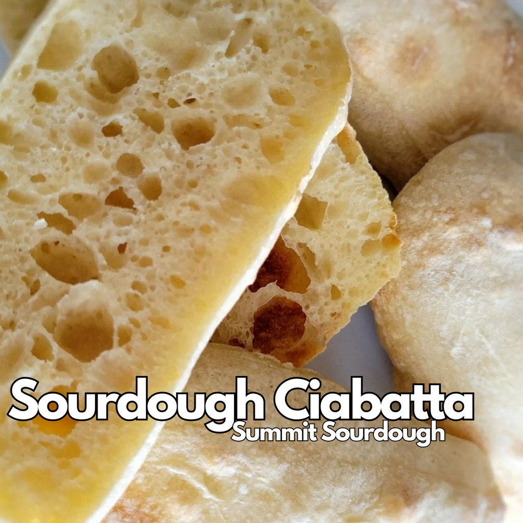 Freshly baked Summit sourdough ciabatta loaf with a crispy crust and airy, open crumb.