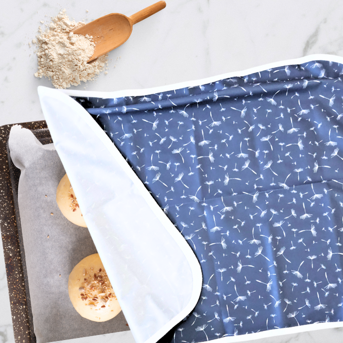 Eco-friendly, reusable baking sheet cover in dandelion print, perfect for keeping dough moist and preventing sticking during proofing.  Hand made in Canada.