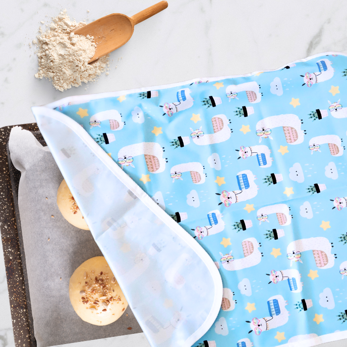 Large 24x18-inch reusable sheet pan proofing cover, non-stick and waterproof, in llama print, made from BPA-free, food-safe fabric.  Hand made in Canada.