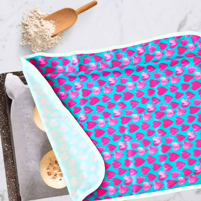 Eco-friendly, reusable non-stick Cookie sheet pan proofing cover / dish cover in a bright hearts print, perfect for covering dough while proofing and keeping dough moist while proofing.